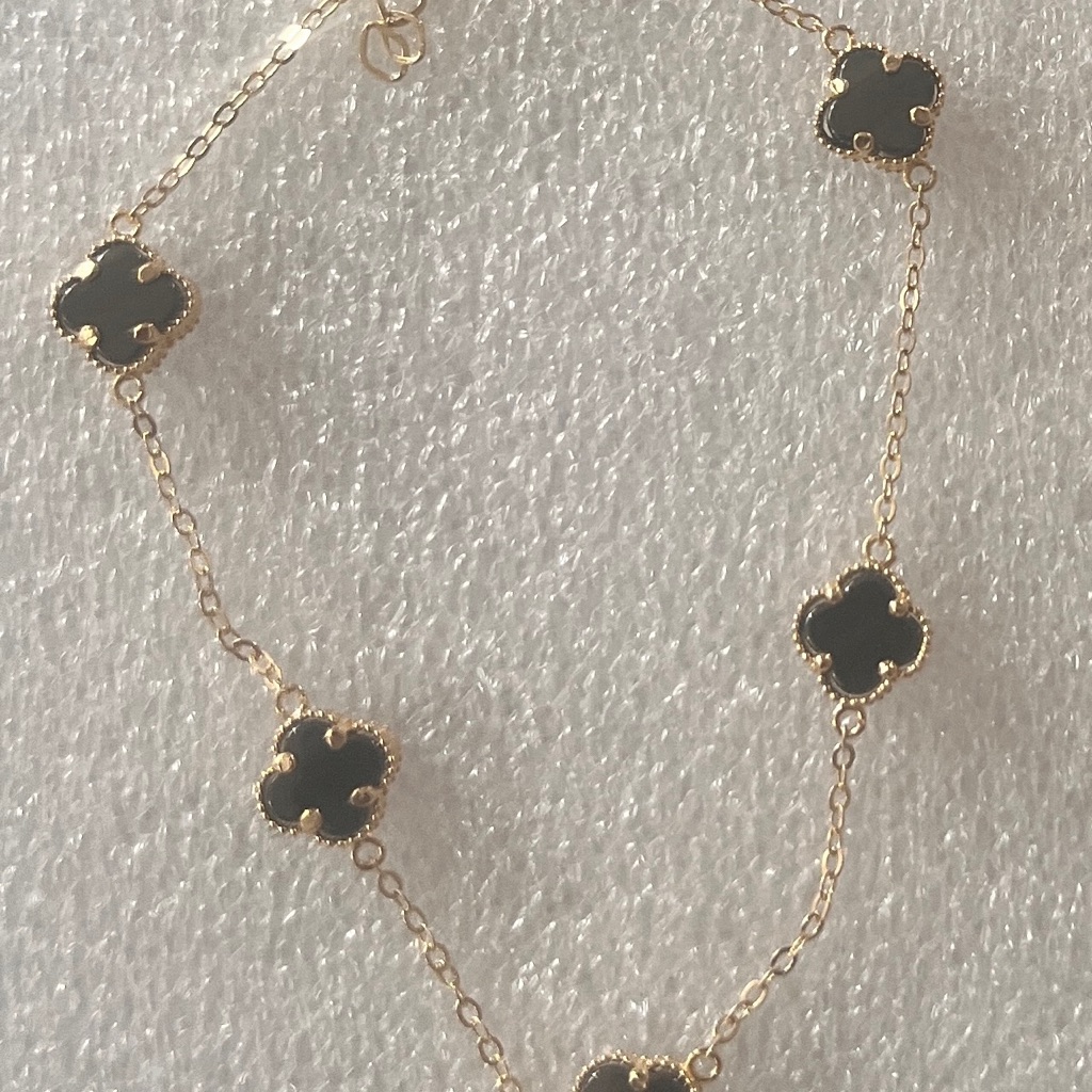 Elegant Gold And Black Clover Necklace